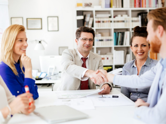 group-of-business-people-working-as-team-in-9HPC4DK-1-1390x1042